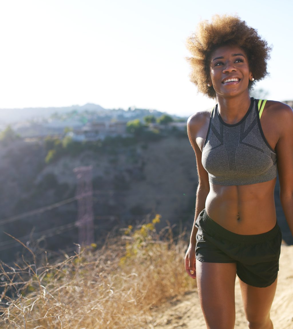 athletic african american woman walking runyon canyon